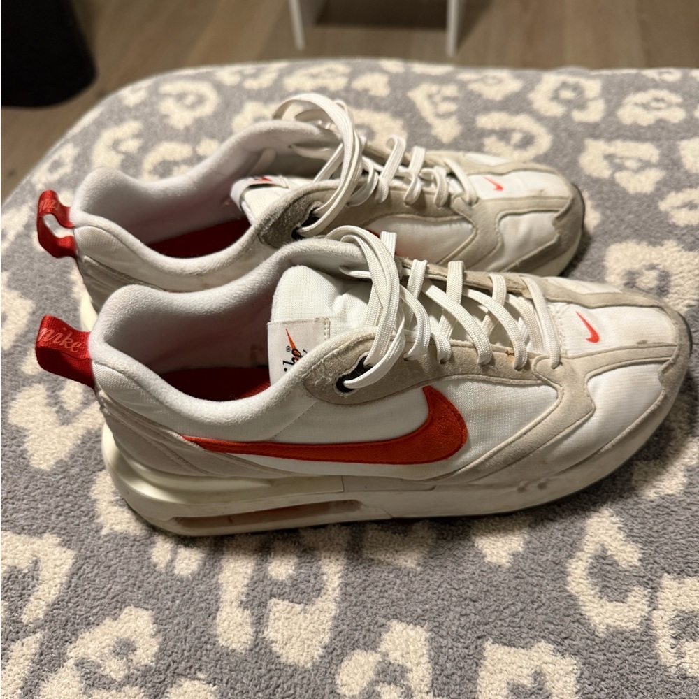 Worn Nike Air Max 360 trainers in white and Red